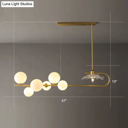 DecorBites postmodern suspension lamp with gold-toned curved arm lotus leaf design and frosted glass spheres