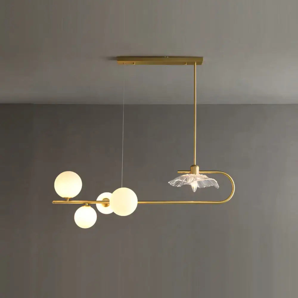 Modern brass postmodern suspension lamp with frosted glass globe bulbs and lotus leaf design crystal accent