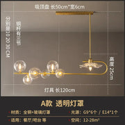 Gold-toned DecorBites postmodern suspension lamp with lotus leaf design featuring glass globe and crystal flower shades