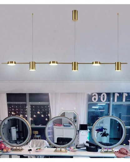 Gold-toned linear led chandelier with five cylindrical fixtures by DecorBites for stylish home decor lighting