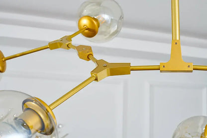 DecorBites™ stylish nordic chandelier with gold-toned metal frame and clear glass globe bulbs for modern living spaces