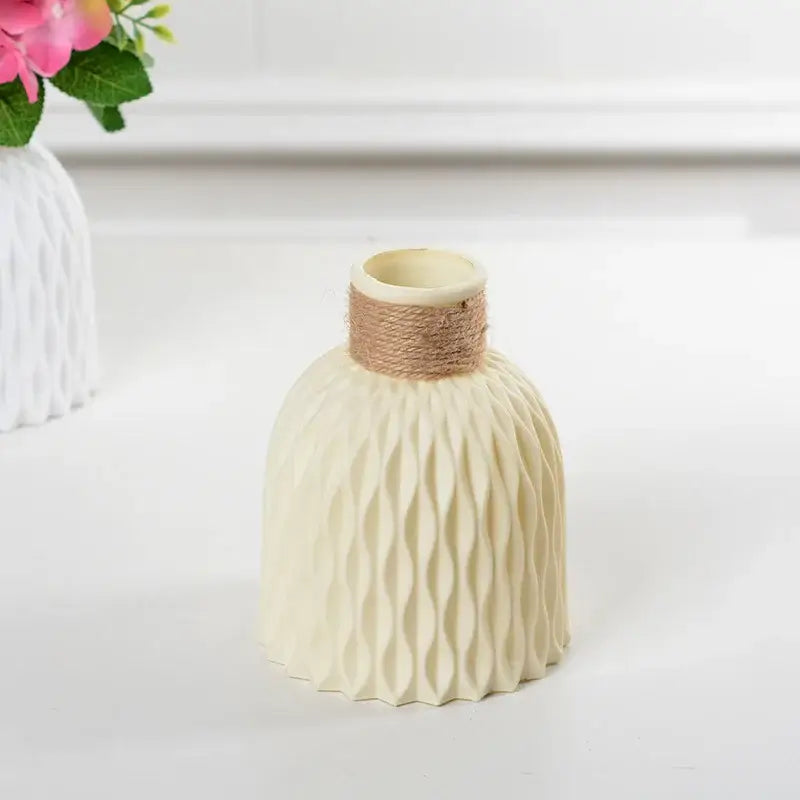 Cream-colored ceramic modern flower vase with textured wavy pattern and natural twine band by decorbites stylish nordic color block