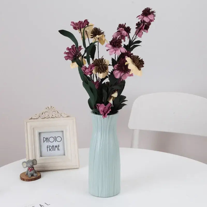 Decorbites™ stylish nordic plastic flower vase in light blue with textured ribs holds dried pink purple beige flowers