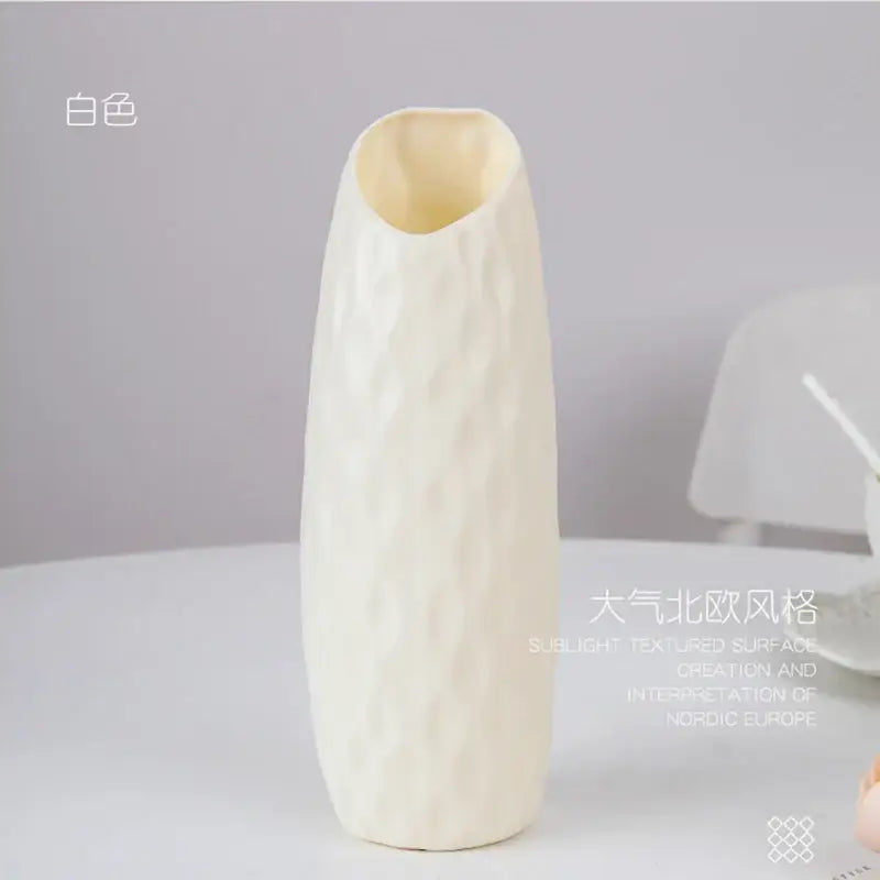 DecorBites™ stylish nordic plastic flower vase in off-white with a textured surface and slightly flared opening