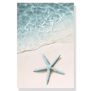 Decorbites™ summer beach seashell canvas wall art featuring a light blue starfish on pale sand by clear water