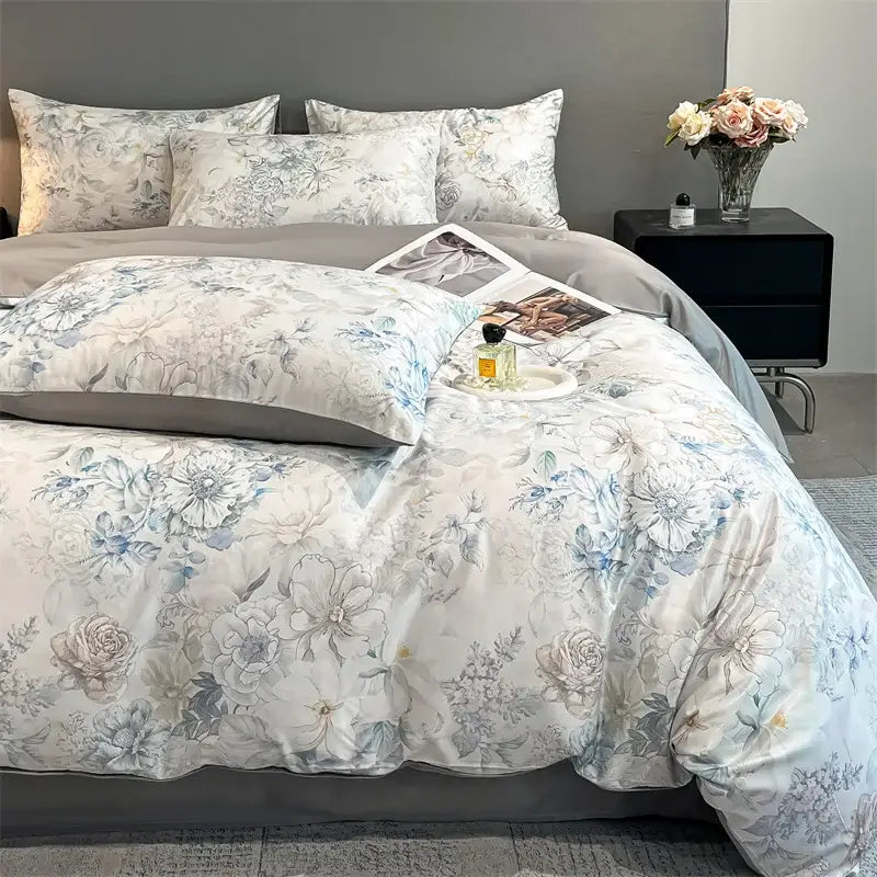 DecorBites™ summer floral satin silk duvet cover set in soft white and muted blue with detailed rose motifs