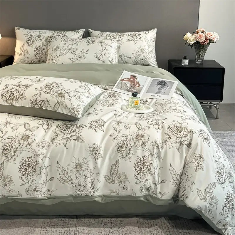 Elegant ivory satin silk duvet cover set with delicate gray floral embroidery and soft sage green border by DecorBites