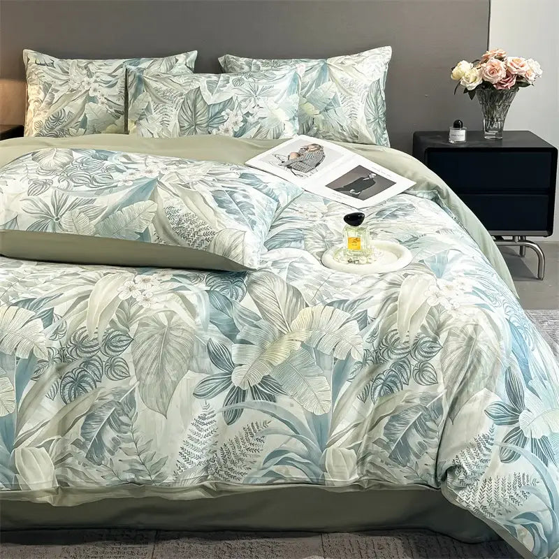Decorbites™ summer floral satin silk duvet cover set featuring soft blue and white tropical leaves with sage green lining