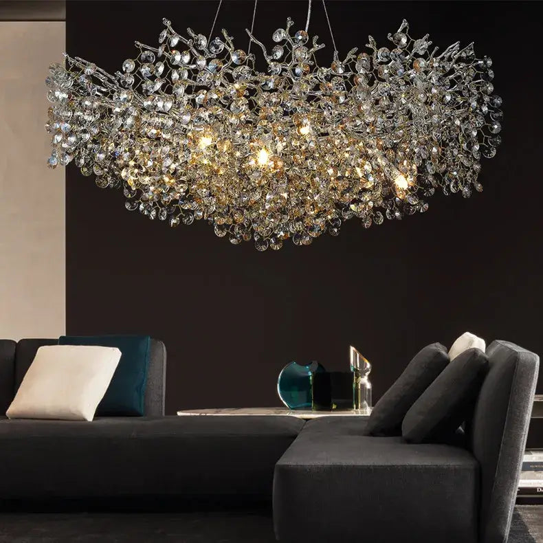 A dazzling decorbites™ sunflower crystal chandelier with clear and gold droplets in a silver frame for dining room