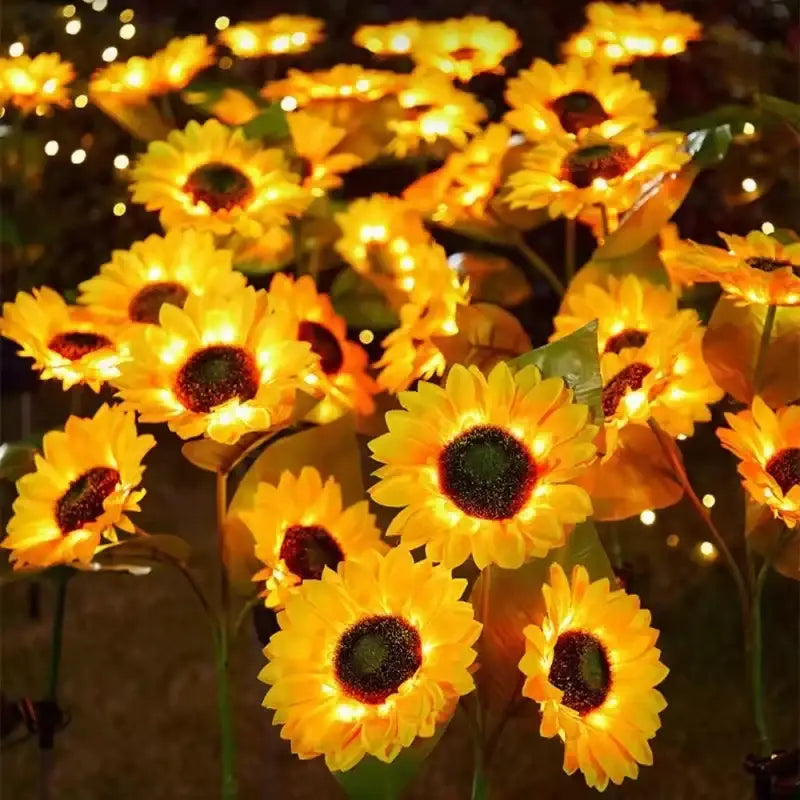 Decorbites sunflower solar garden light with auto brightness features golden glowing petals and green stems for lawn use