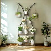 Decorbites™ tall black metal plant stand shaped like a bunny with wood accents and multiple tiers holding ceramic pots