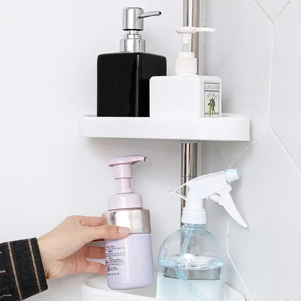 White plastic corner shelf with two tiers holding bathroom products in rust-proof stainless steel telescopic shower rack organizer
