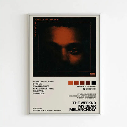A framed poster of the weeknd music album my dear melancholy featuring dark orange lighting for home decor