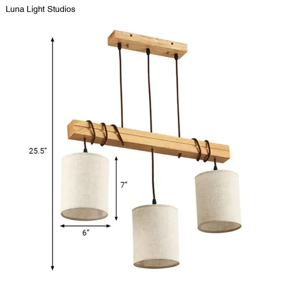 A minimalist wooden chandelier with three off-white fabric shades and black cords ideal for dining room fixture width e26 e27