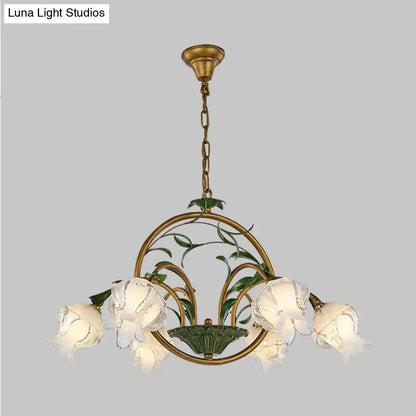 Antique brass DecorBites traditional floral chandelier with five frosted glass flower shades and green leaf accents compatible with e12 e14 110v-120v and 220v-240v led incandescent fluorescent bulbs