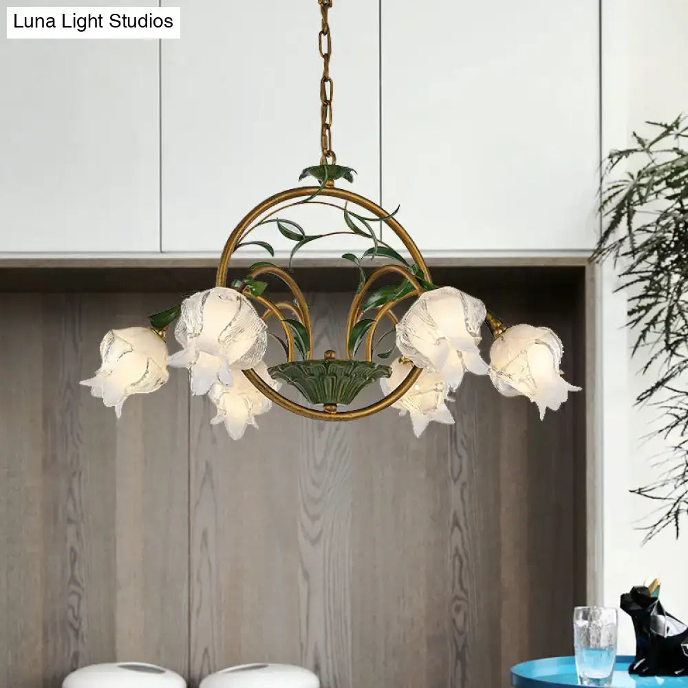Antique brass chandelier with five frosted glass bell shades and green ceramic leaves compatible with e12 e14 bulbs