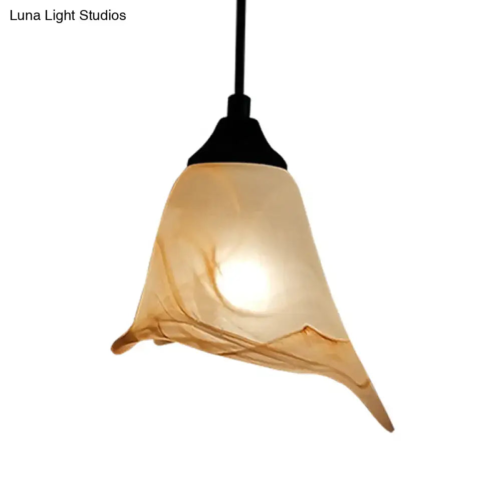 DecorBites™ warm-toned hand-blown glass pendant light with flower cone shape and amber hue for living room