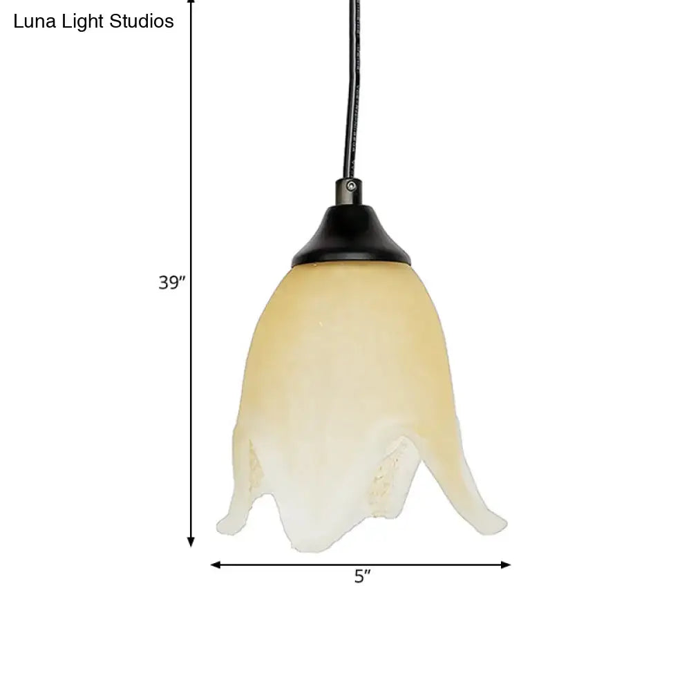 DecorBites™ traditional cream-colored glass pendant light with flower cone shape and black metal top for living room