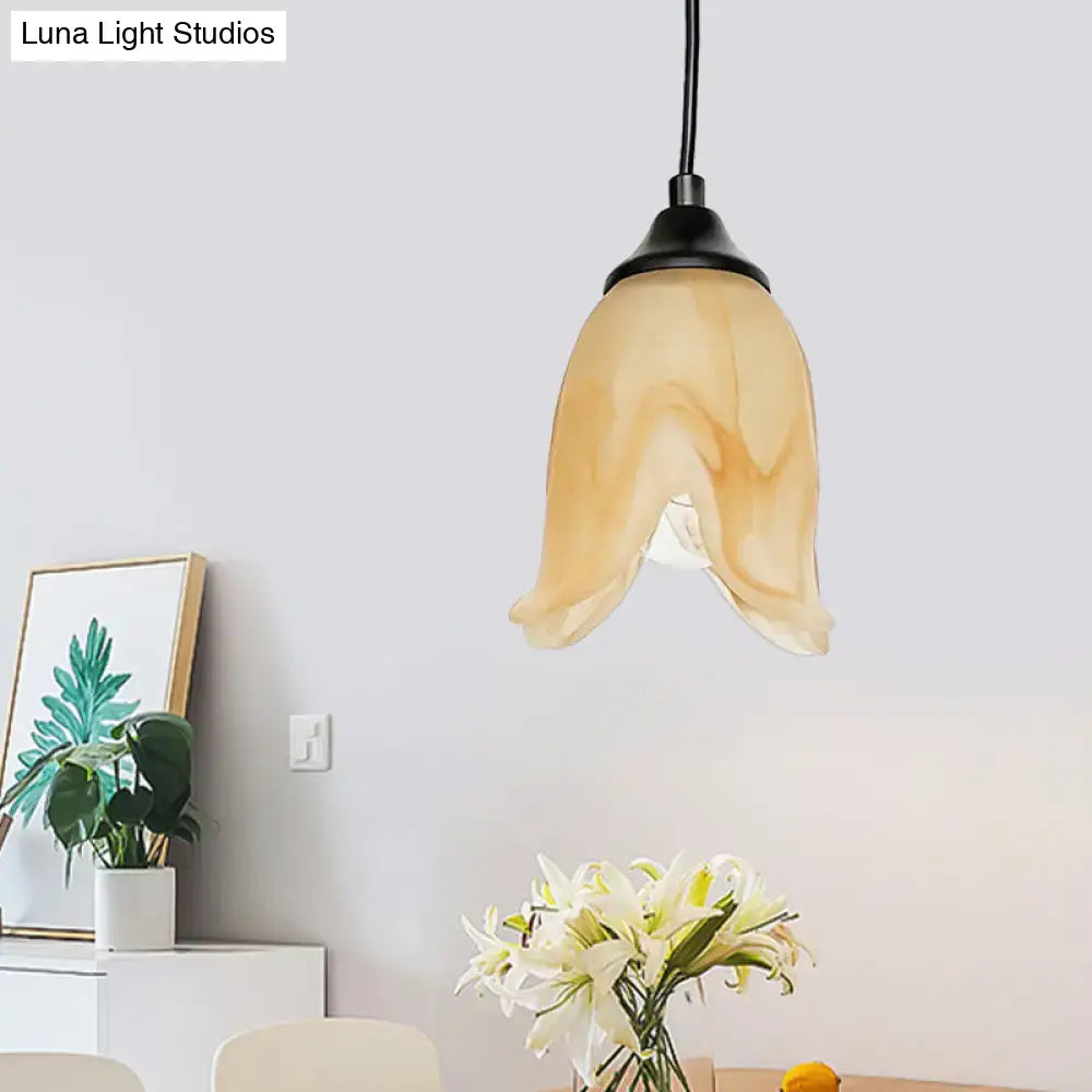 DecorBites™ traditional amber glass pendant light with black metal fixture in flower cone shape for living room use