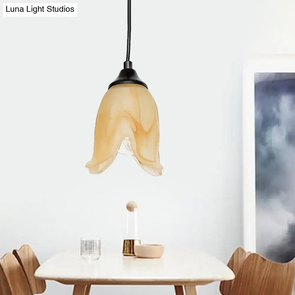 DecorBites™ traditional amber glass pendant light with flower cone shape and black metal fixture for living room use
