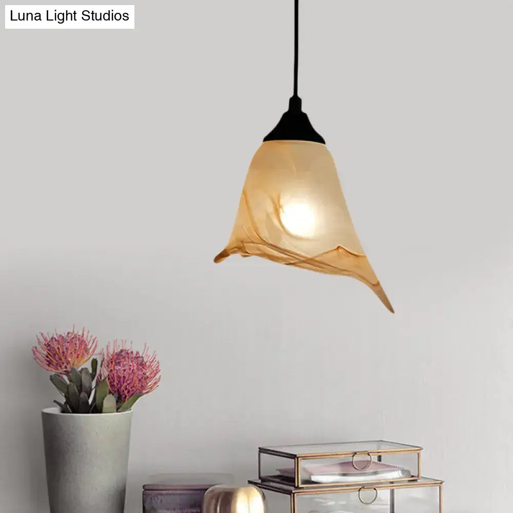 DecorBites™ traditional amber glass pendant light with flower cone shape and black metal fixture for living room