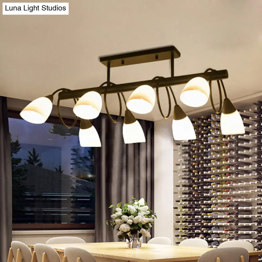 Modern brass-finished pendant light fixture with six frosted glass shades in a sleek curved design by DecorBites™