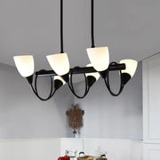 Black metal pendant light fixture with five frosted milky glass shades for traditional indoor lighting