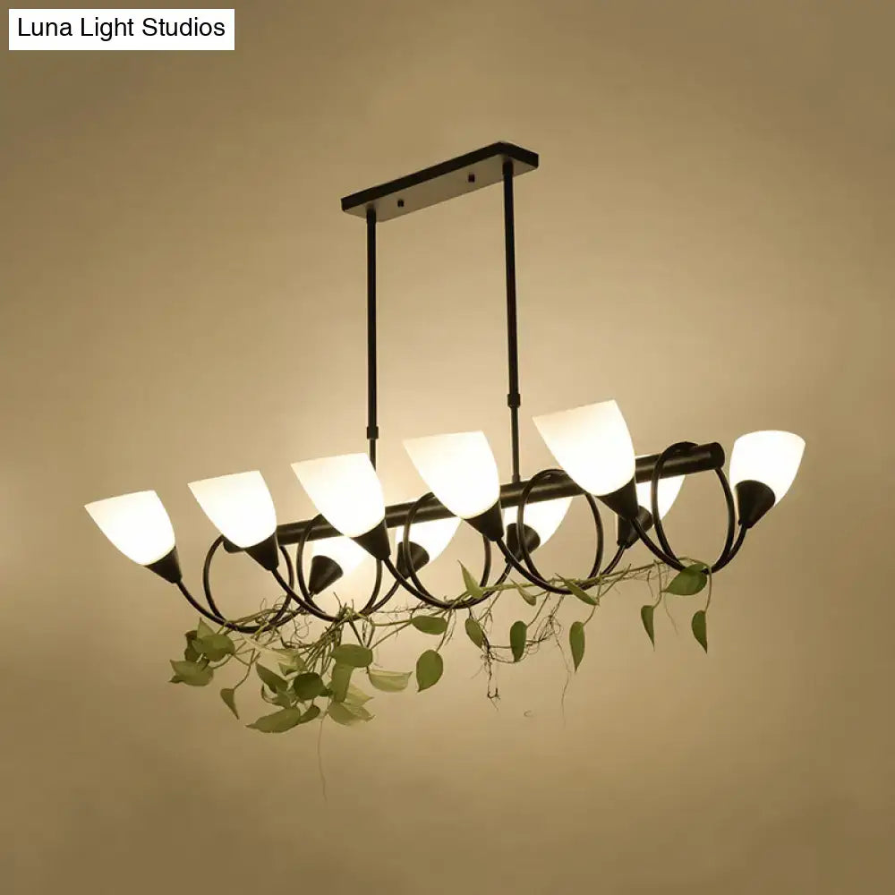 DecorBites traditional black metal pendant light fixture with six frosted glass shades and trailing green vines