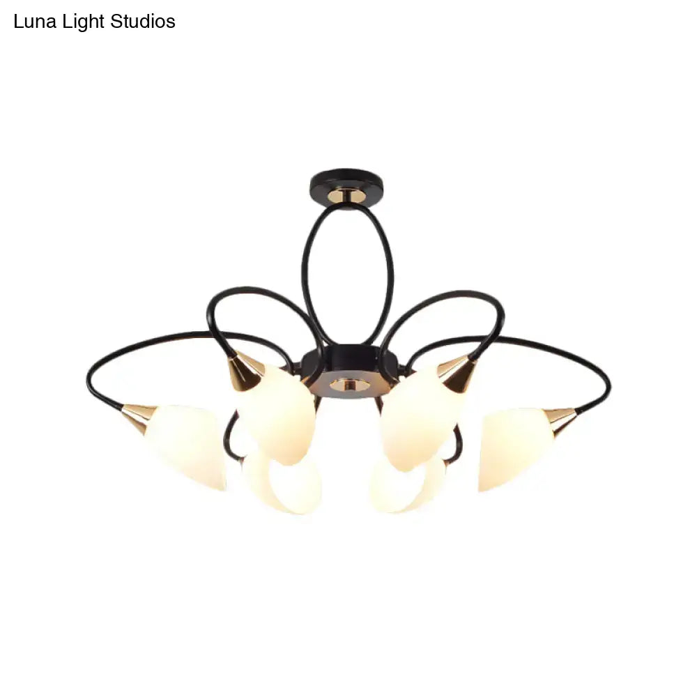 Black metal chandelier with five frosted oval white glass shades and gold-toned accents for living room lighting