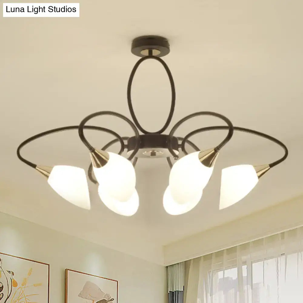 Black metal chandelier with five frosted oval white glass shades and gold-toned accents for living room lighting