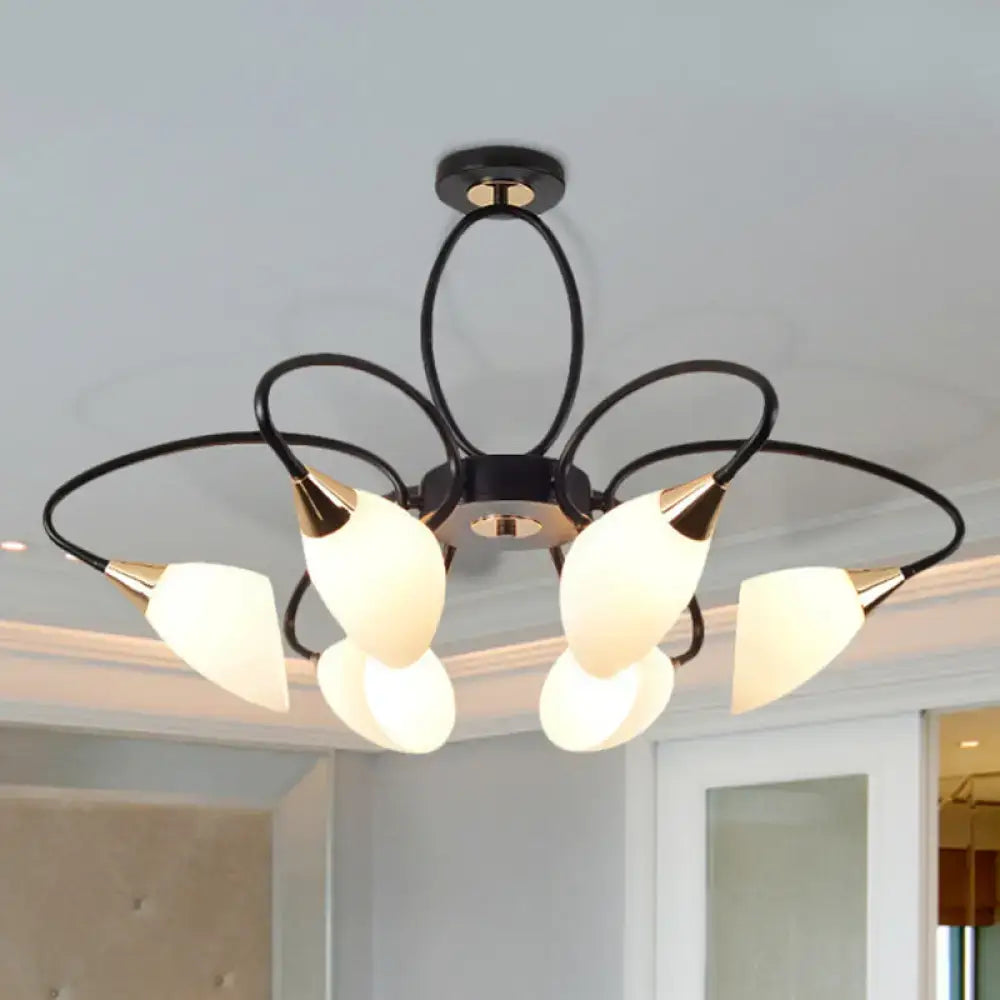 Black metal chandelier with five frosted oval white glass shades and gold-toned accents for traditional decor