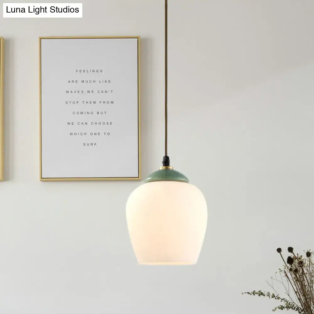 DecorBites™ pendant light with soft white glass lamp fixture and matte sage green ceramic top for restaurants