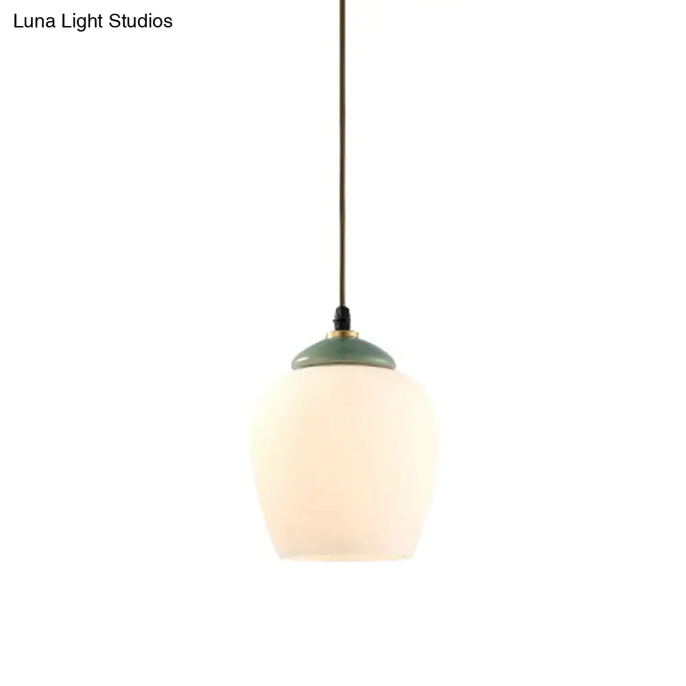 Decorbites traditional white glass pendant light with matte green ceramic top and brass cord for restaurants