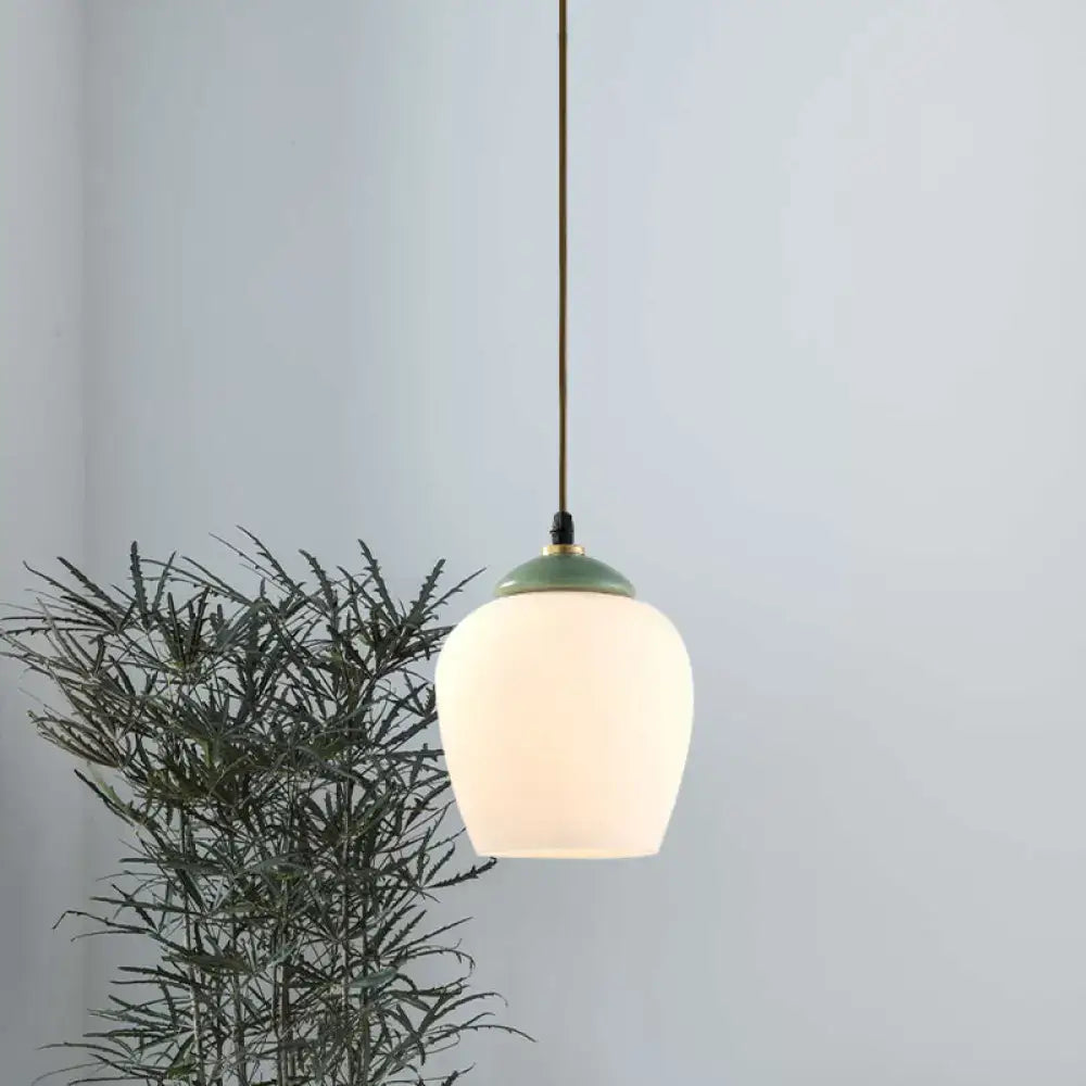 Decorbites traditional pendant light with frosted white glass globe and matte green ceramic top for restaurants