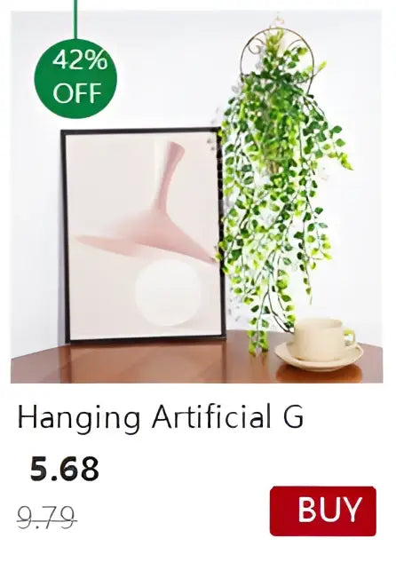 Hanging artificial green ivy plant with cascading leaves displayed in a decorbites™ transparent nordic vase with circular frame