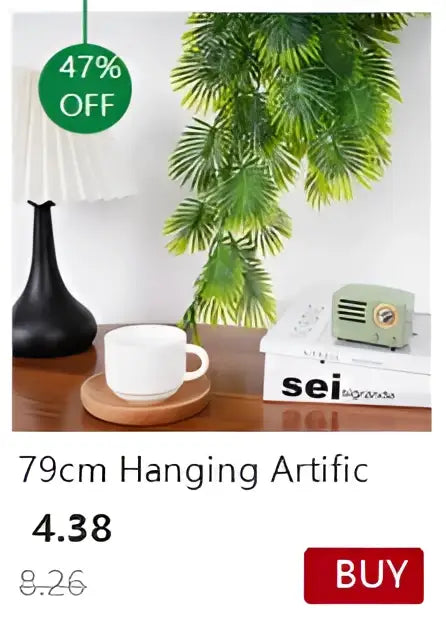 Black hanging artificial plant with feathery green leaves in a transparent nordic vase for plants and flowers by decorbites