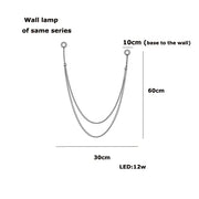 Silver-toned minimalist wall lamp with sleek v-shaped design and curved arms for DecorBites™ flexible leather belt LED chandelier