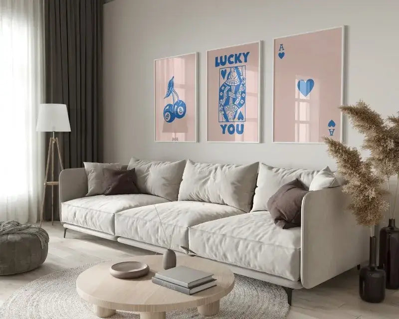 Beige upholstered sectional sofa with dark brown throw pillows displayed alongside decorbites trendy retro wall art posters set queen of hearts