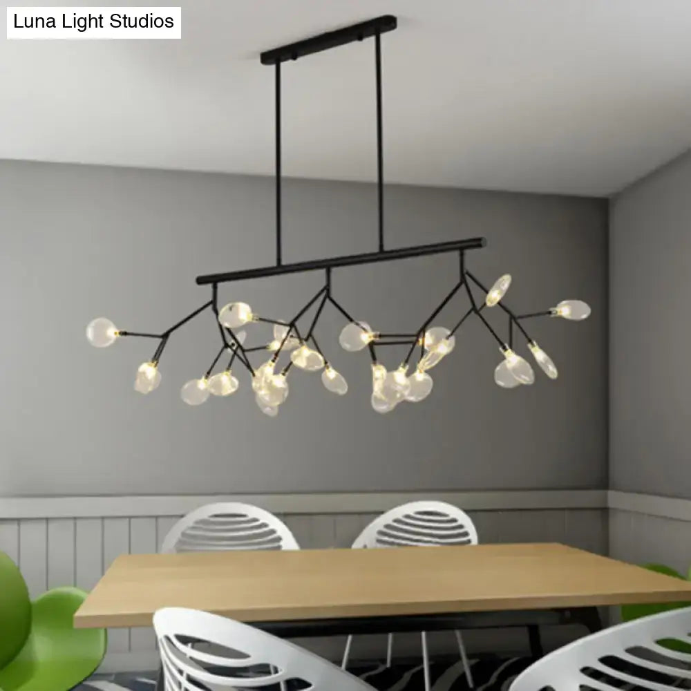 Modern black metal chandelier with branching arms and frosted glass globe bulbs for dining room light fixture