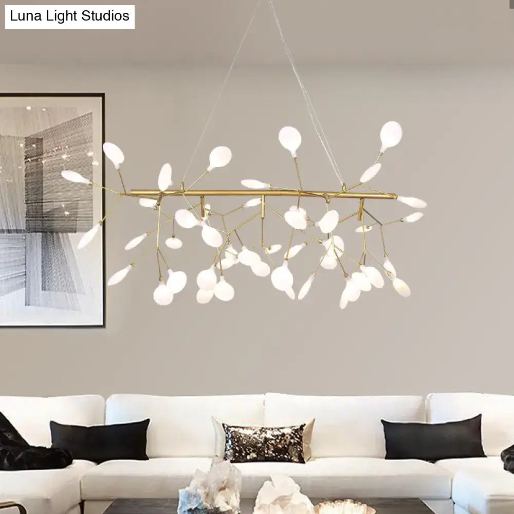 Gold-toned branch-style linear firefly pendant lighting with frosted white leaf-shaped glass globes for living room ceiling light
