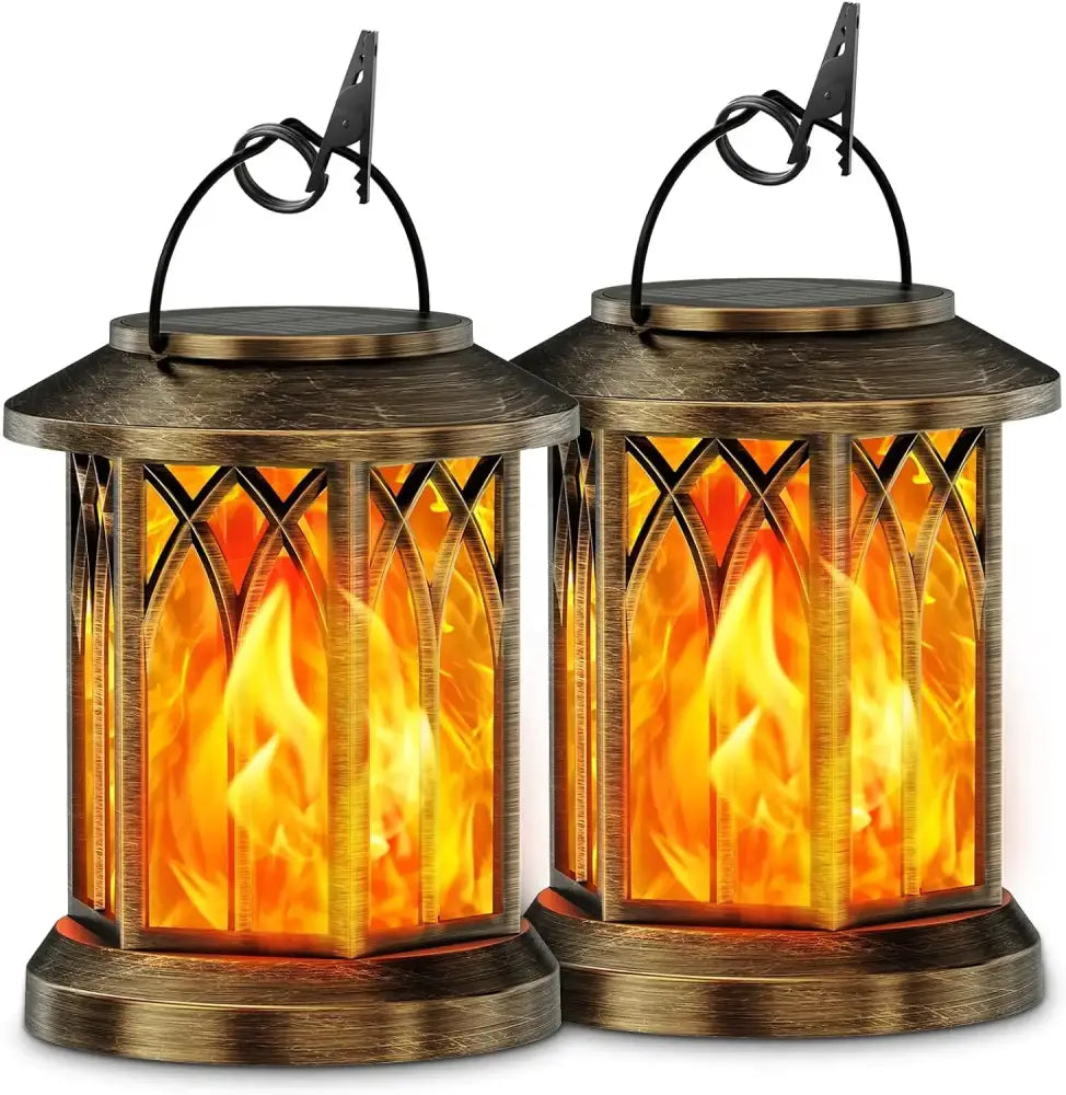 Two bronze-finished solar lanterns with gothic arched glass panels and upgraded flickering flame effects by DecorBites