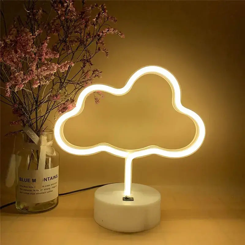 A warm white led neon sign shaped like a cloud with minimalist design from decorbites usb holiday lamp collection