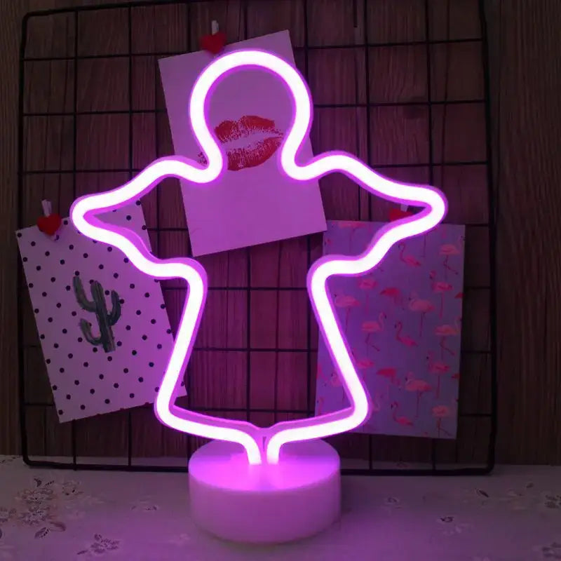 Purple led neon sign shaped like a ghost with glowing edges mounted on white base for home decoration gift