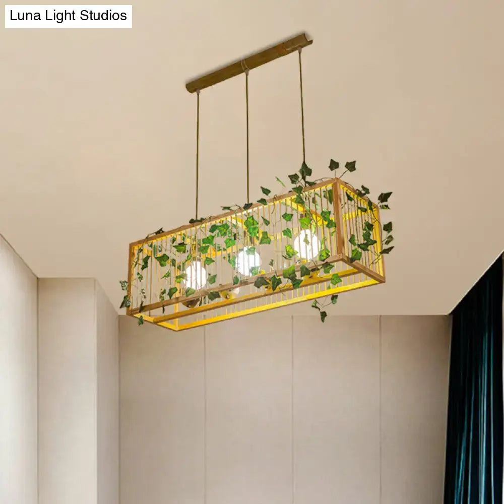 Decorbites™ vintage beige bamboo pendant light with gold-toned cage and green leaves ideal for tea room lighting