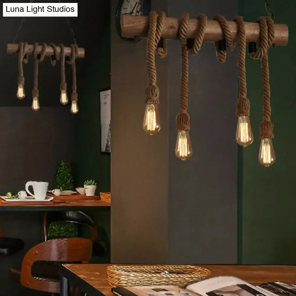 Rustic wooden beam pendant light with thick brown hemp rope and vintage edison bulbs featuring adjustable chain cord length