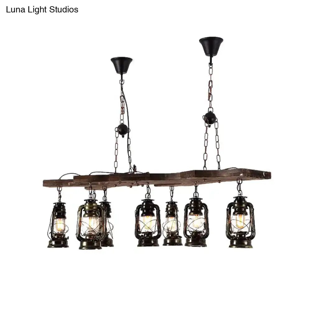 DecorBites™ vintage industrial linear chandelier with six black metal lanterns and antique brass accents on a wooden beam