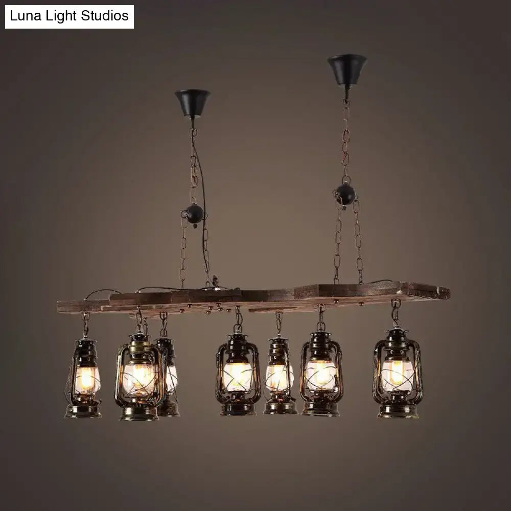 DecorBites vintage industrial 8-light linear chandelier with antique brass lantern shades hanging from rustic wood beam