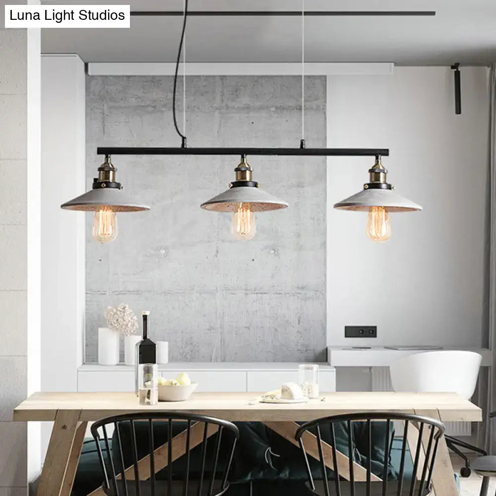 DecorBites™ vintage island hanging light with matte gray cement pendant shades and brass accents featuring Edison bulbs
