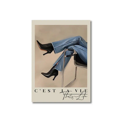 Black leather high-heeled ankle boots paired with light blue denim jeans next to DecorBites™ vintage pink cartoon print canvas wall art