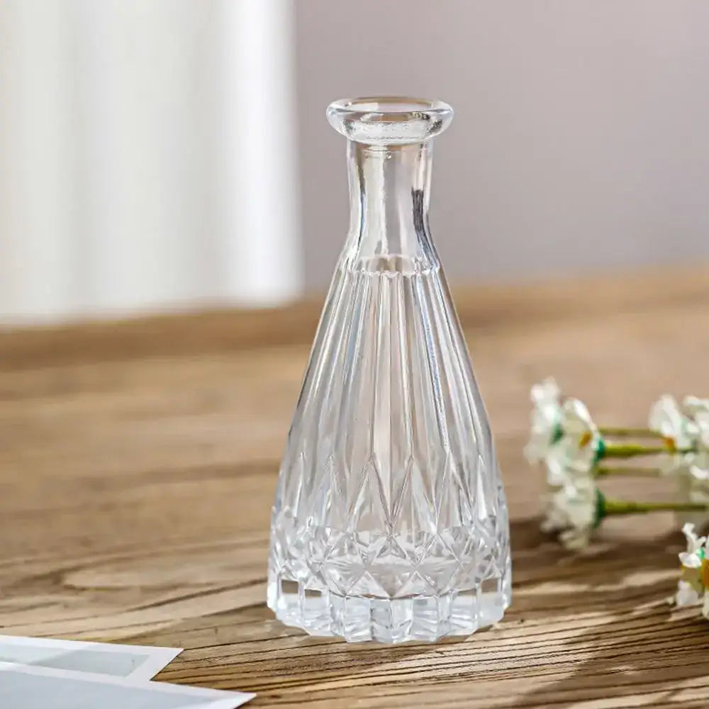 Clear crystal vintage relief vase with faceted geometric patterns and slender neck for hydroponic plants by decorbites